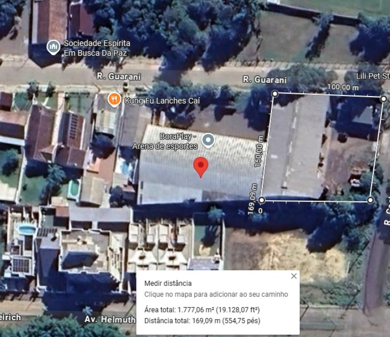 TERRENO COM ÁREA DE 1.748,09m² COM UMA CASA DE MADEIRA DE 150m² E PAVILHÃO DE 900m² EM SÃO SEBASTIÃO DO CAÍ